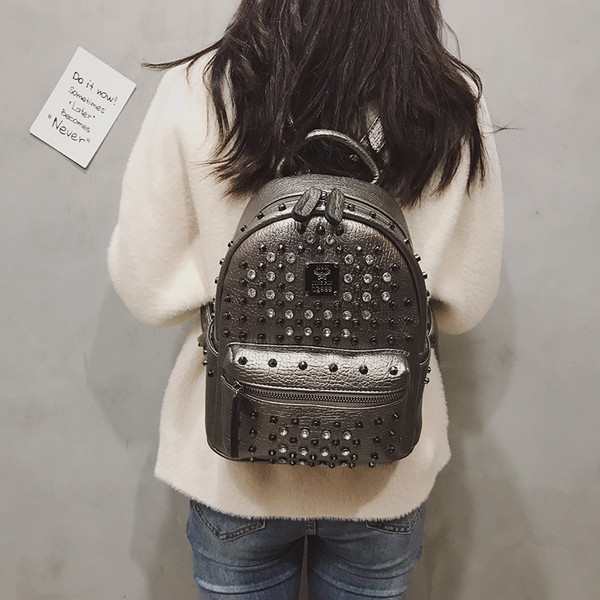 Дамска раница от еко кожа с метална декорация