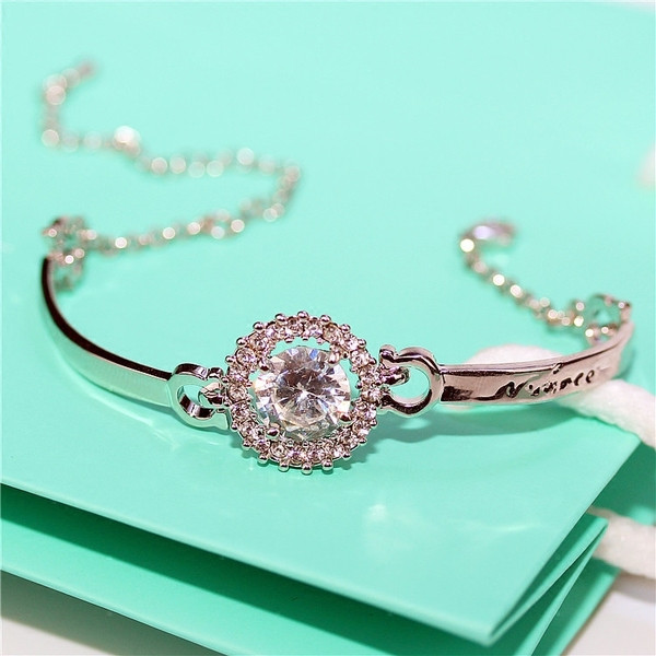 Brățară elegantă de damă cu pietre de culoare argintie și aurie