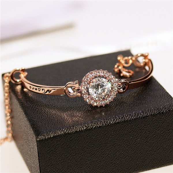 Brățară elegantă de damă cu pietre de culoare argintie și aurie