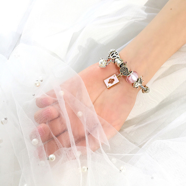 Γυναικείο βραχιόλι με μενταγιόν και διακοσμητικές πέτρες σε δύο χρώματα