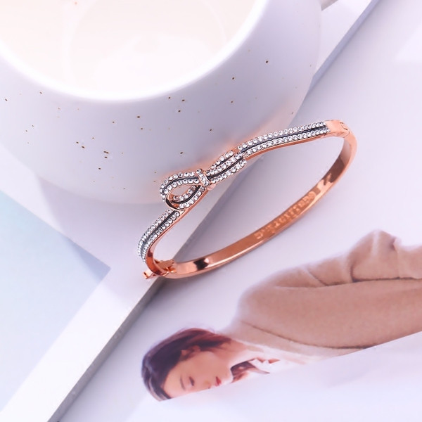 Γυναικείο βραχιόλι σε ασημί και χρυσό χρώμα με διακοσμητικές πέτρες