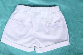 Μοντέρνα παιδικά παντελόνια για κορίτσια με έγχρωμο κεντήματα σε λευκό