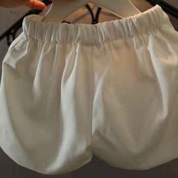 ХИТ Актуални детски къси  панталони за момичета с елемент -панделка в бял цвят 
