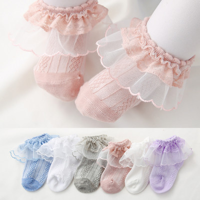 Set of four children`s socks with lace for girls