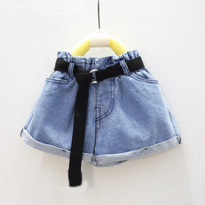 Modern children`s short jeans for girls with a belt in a light color