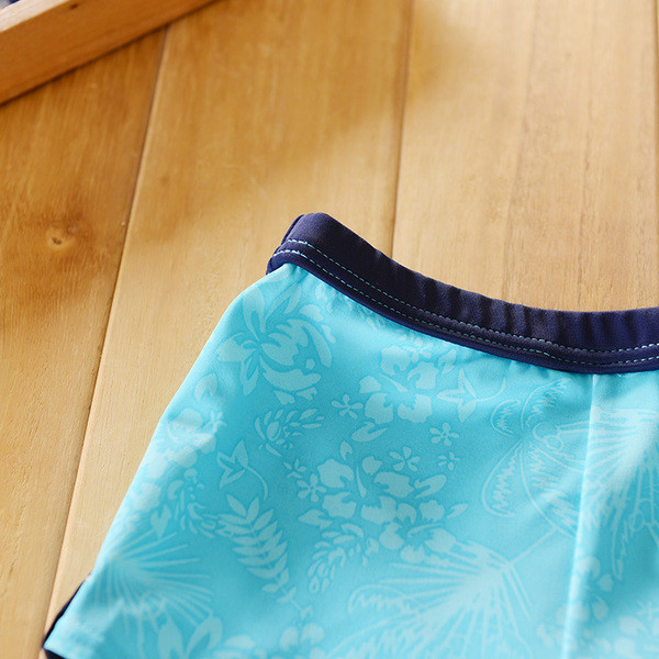 Moдерни детски бански в син цвят с цветен кант