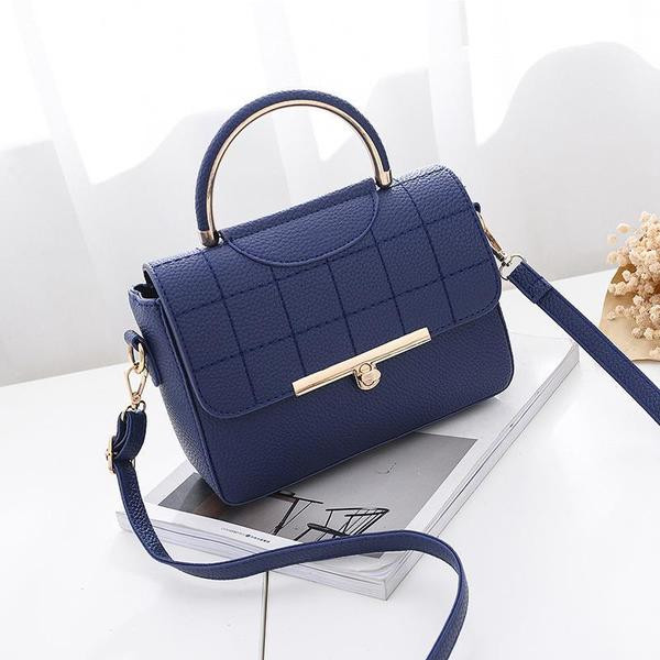 Modern női táska eko bőrből, fém rögzítéssel