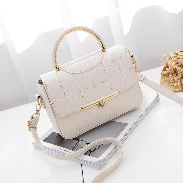 Modern női táska eko bőrből, fém rögzítéssel