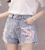 Női topikus nadrág magas derékkal és gyöngyökkel