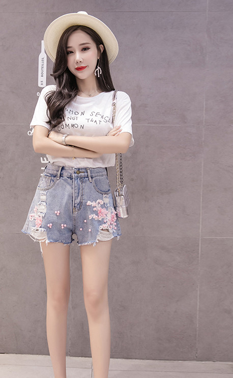 Női topikus nadrág magas derékkal és gyöngyökkel