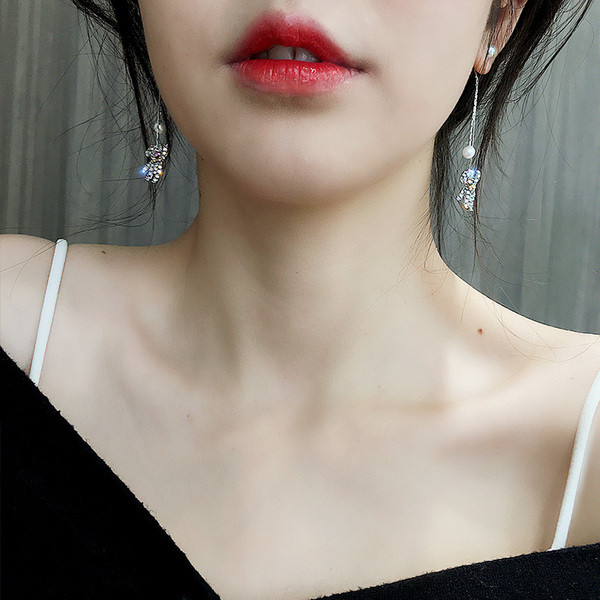 Női fülbevaló ezüst színben medállal