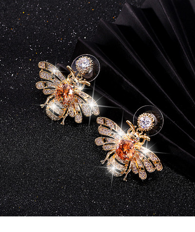 Cercei eleganti de dama cu pietre de culoare aurie