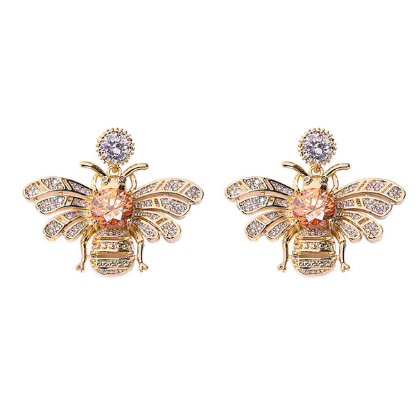 Cercei eleganti de dama cu pietre de culoare aurie