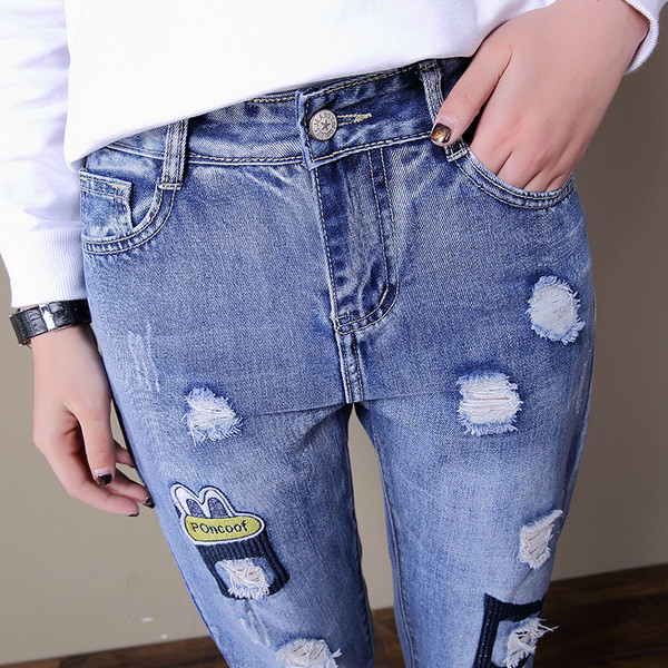 Blugi de dama moderni cu talie inalta si motive rupte