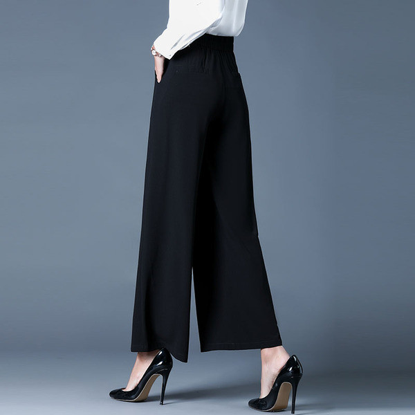 Modern női magas derekú nadrág fekete-fehér színben