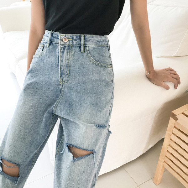 Stílusos női szakadt farmer, magas derékkal
