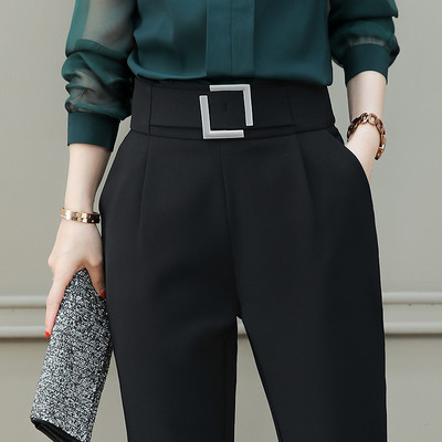 Elegant women`s pants in black with a buckle
