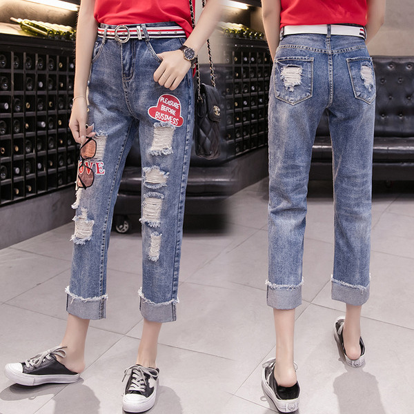 Blugi casual de dama cu motiv rupt si emblema