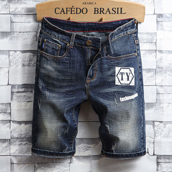 Κομψά βραδινά τζιν ανδρικά σε δύο χρώματα με εφαρμογή και επιγραφή