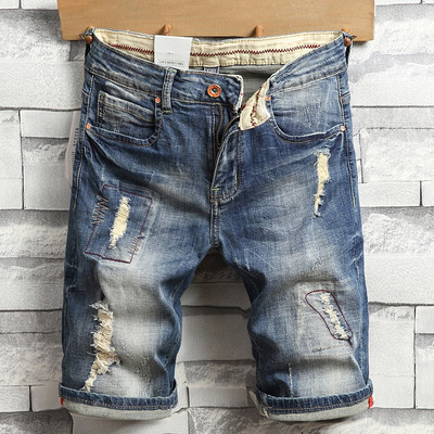 Férfi alkalmi rövidnadrág szakadt motívumokkal