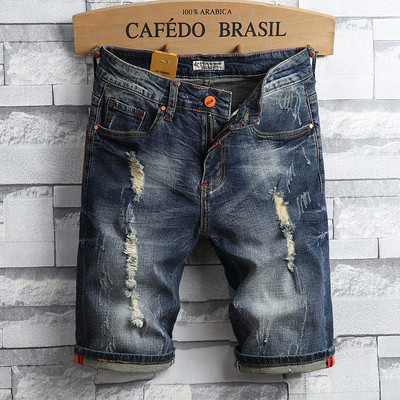 Férfi modern rövid farmernadrág szakadt motívumokkal