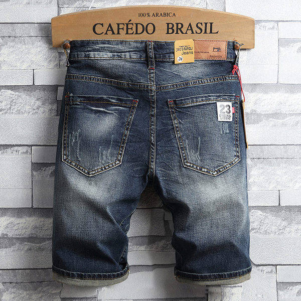 Férfi modern rövid farmernadrág szakadt motívumokkal