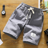 Alkalmi férfi rövidnadrág több színben emblémával és nyakkendővel