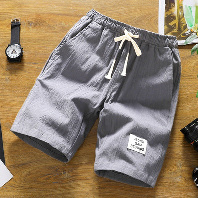 Alkalmi férfi rövidnadrág több színben emblémával és nyakkendővel