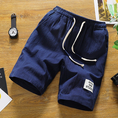 Alkalmi férfi rövidnadrág több színben emblémával és nyakkendővel