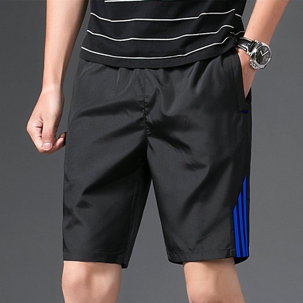 Τα casual παντελόνια ανδρών σε μαύρο χρώμα με χρωματιστές λωρίδες