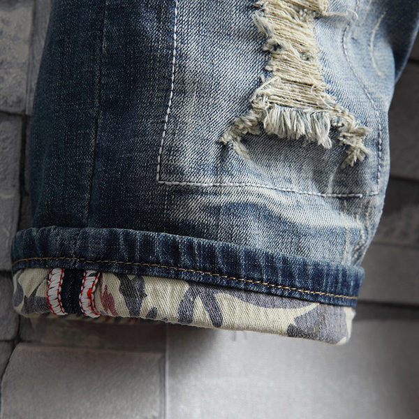 Lezser férfi rövid farmernadrág szakadt motívumokkal