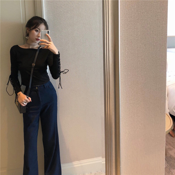 Alkalmi női rövid fekete blúz ujjkötővel