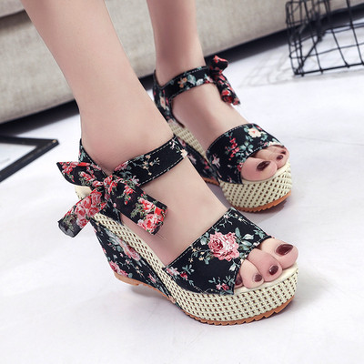 Modern women`s sandals with floral motifs and a ribbon in several colors