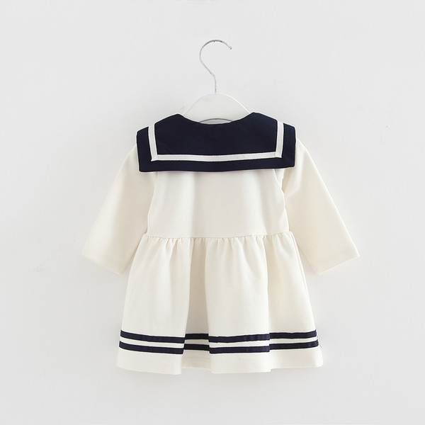 Modern gyerekruha fehér és sötétkék színben