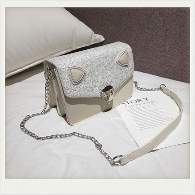 Modern női táska eko bőrből, hosszú füllel