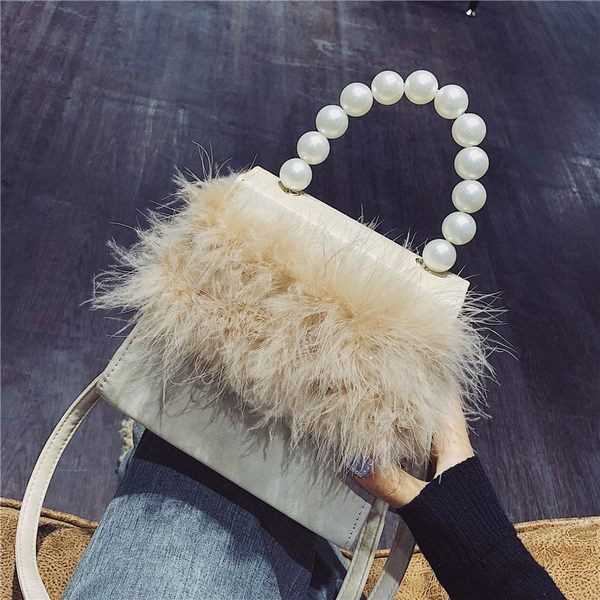 Stílusos női táska, hosszú és rövid fülekkel és gyöngyökkel díszítésre