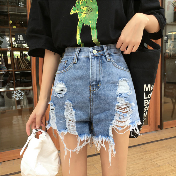 Blugi de dama moderni cu motive rupte de culoare albastra si talie inalta