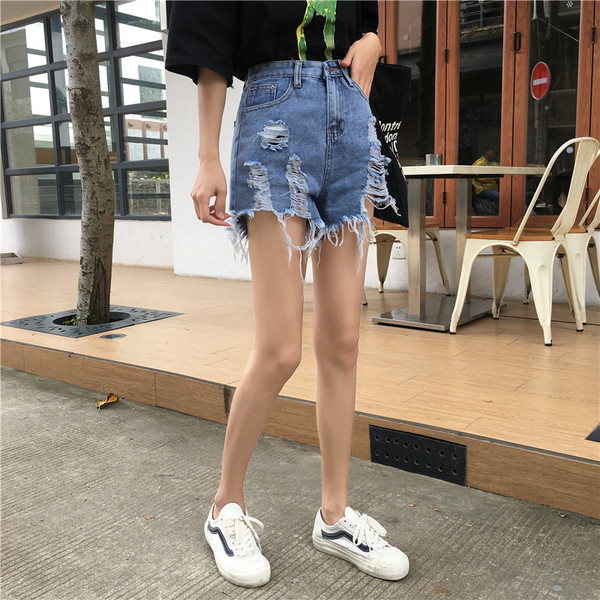 Blugi de dama moderni cu motive rupte de culoare albastra si talie inalta