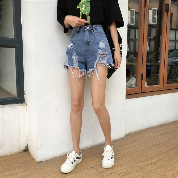 Blugi de dama moderni cu motive rupte de culoare albastra si talie inalta