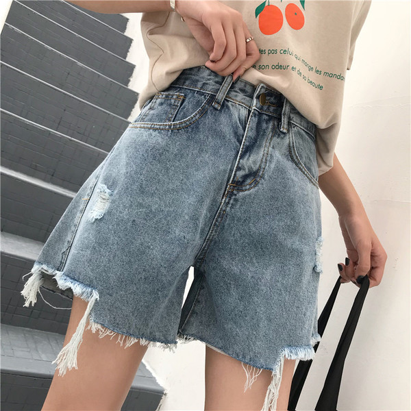 Blugi scurti de dama cu motive rupte si talie inalta in albastru