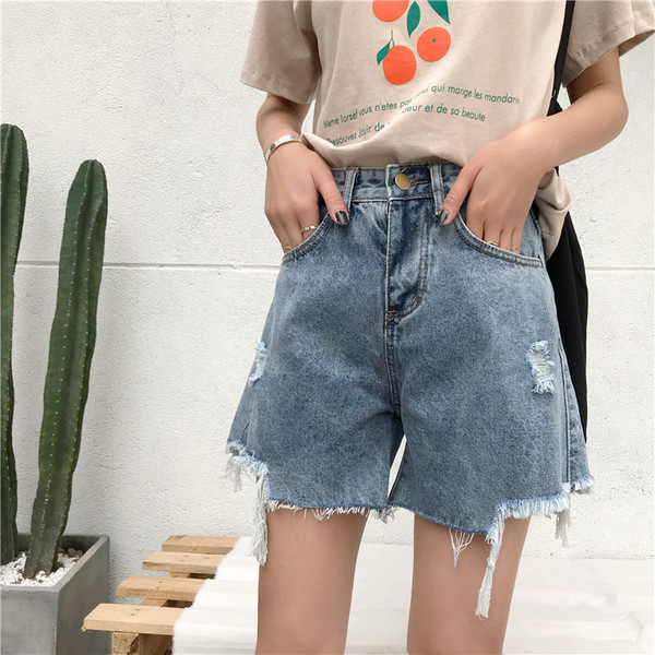 Blugi scurti de dama cu motive rupte si talie inalta in albastru