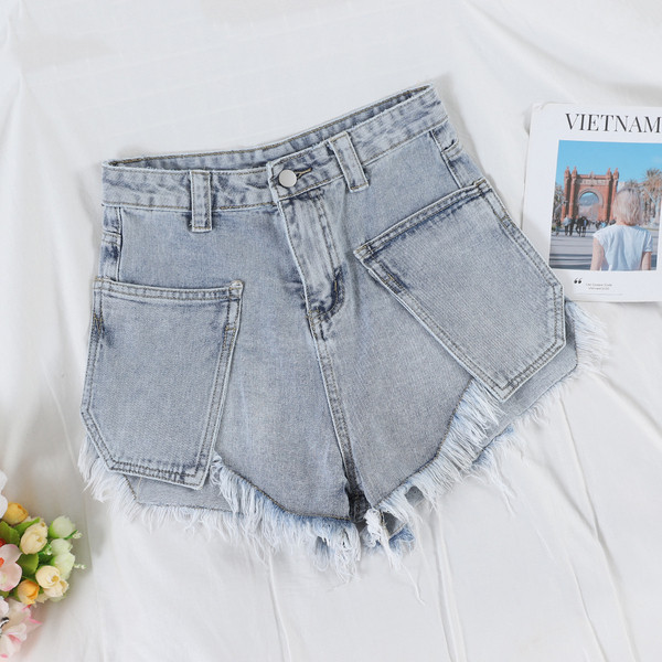 Modern női farmer rövidnadrág szakadt motívumokkal