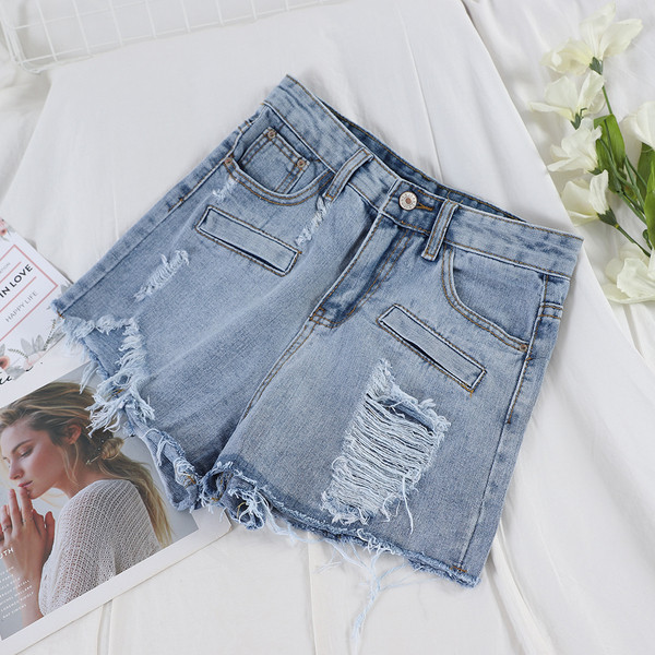 Blugi scurti moderni de dama cu motive rupte si buzunar in albastru