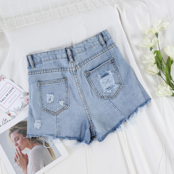 Blugi scurti moderni de dama cu motive rupte si buzunar in albastru