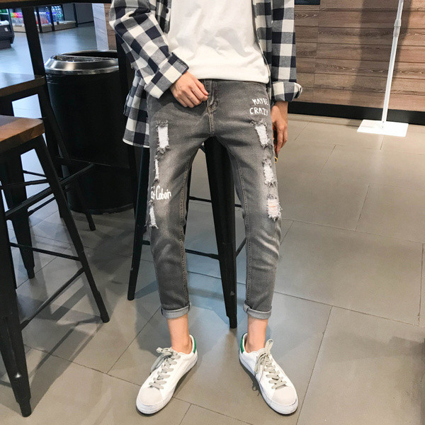 Blugi de bărbați actuali cu inscripții și motive rupte