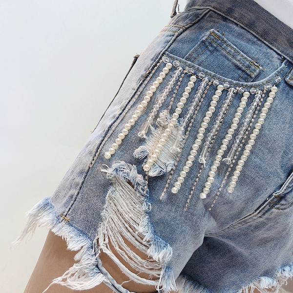 Стилни дамски дънки с разкъсани мотиви и висока талия