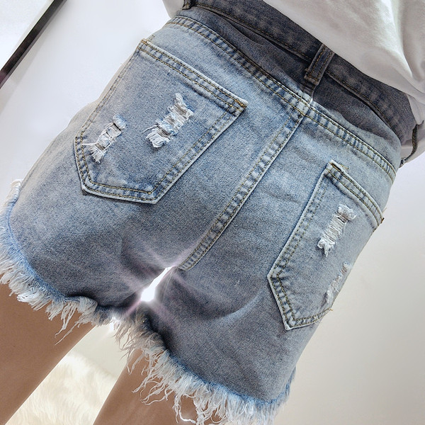 Стилни дамски дънки с разкъсани мотиви и висока талия