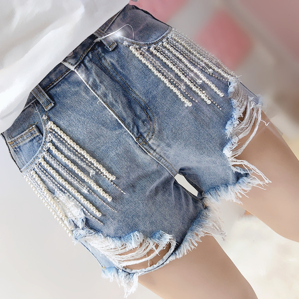 Стилни дамски дънки с разкъсани мотиви и висока талия