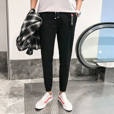 Férfi sport- és alkalmi nadrág két színben felirattal és nyakkendővel