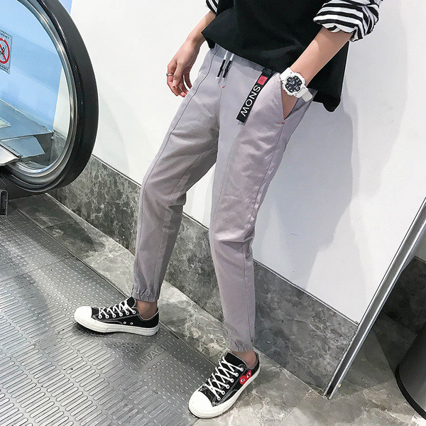 Férfi sport- és alkalmi nadrág két színben felirattal és nyakkendővel